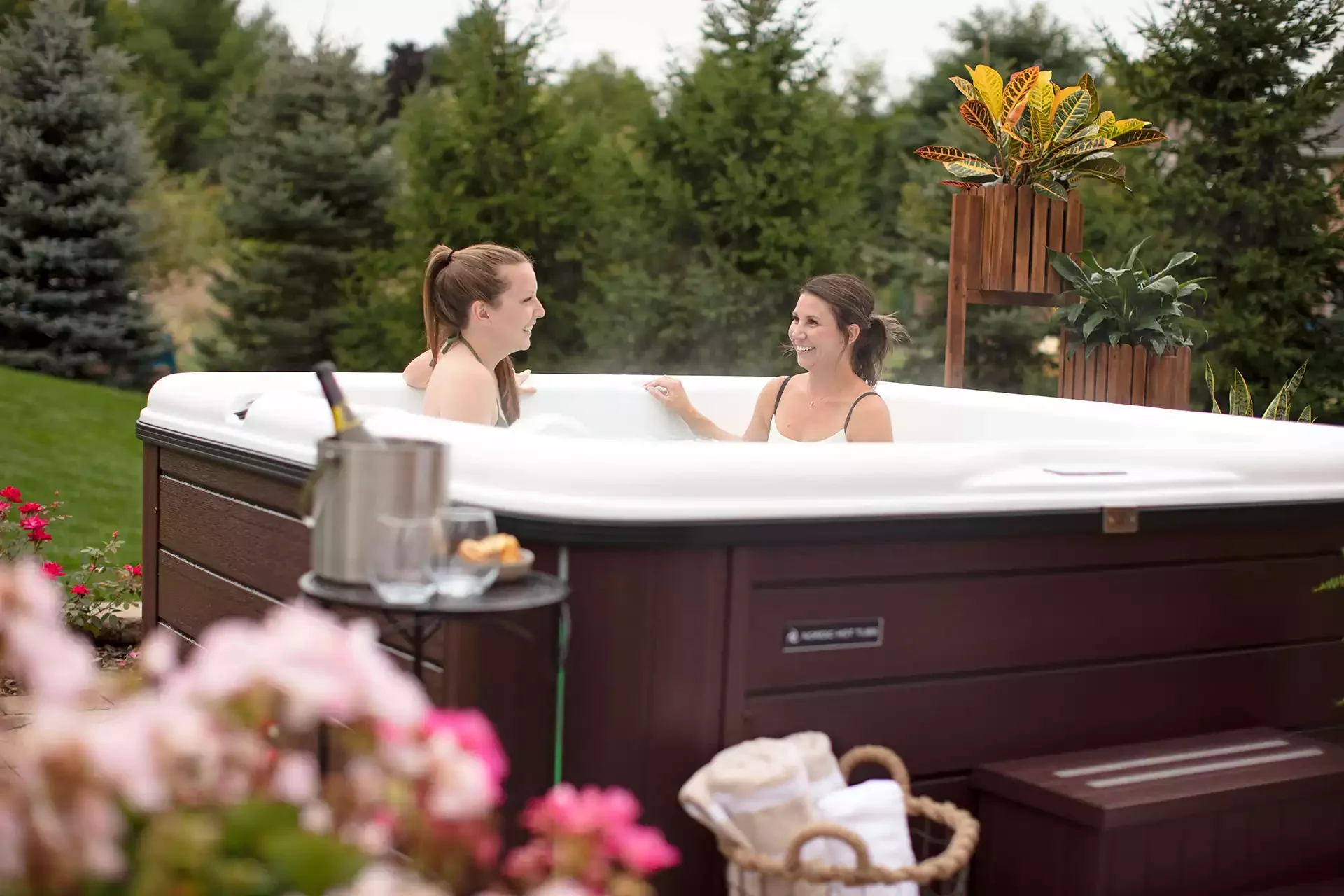 woman relaxing in the nordic hot tub with her friend